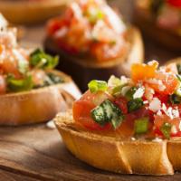 Bruschetta · Diced tomatoes and basil in balsamic, served on an Italian crostini 