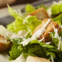 Caesar Salad · Romaine hearts, seasoned croutons, anchovies, Parmesan and homemade dressing.