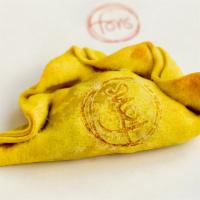 Corn & Poblano · Turmeric scented dough filled with sweet corn and poblano peppers.