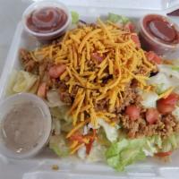 Taco Salad · Vegan Grounds, Lettuce, tomato, Onion, Cheez, Salsa, Dressing