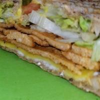 Vegan Hog Sandwich · Vegan Ham, Vegan Swiss, Onion, Lettuce, Tomato, Pickle, Mustard
