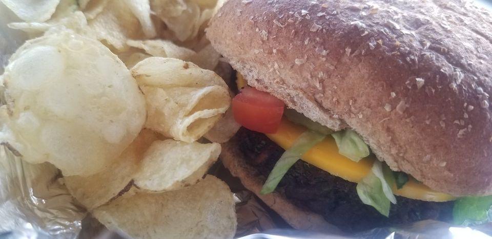 Vegan Burger · House made vegan patty, Lettuce, Tomato, Onion, Pickle, Mustard served with chips