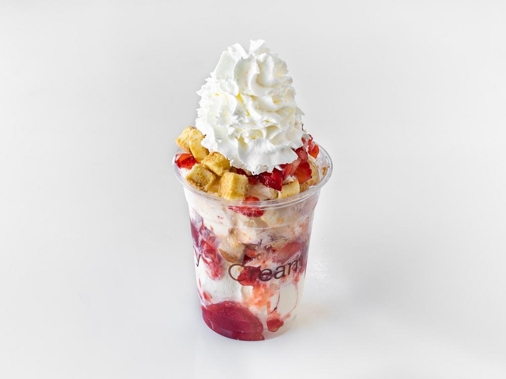 Strawberry Bond · Vanilla ice cream layered with strawberries, cheesecake bites and strawberry sauce
