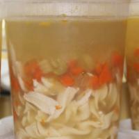 Chicken Noodle Soup · Onion, carrot, celery, thyme, chicken, egg noodle and chicken stock.