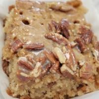 Pecan Butter Bread · Pecan bread topped with caramel and pecan pieces.