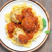 Spaghetti Squash with Chicken Meatballs · Ground chicken and veggie meatballs served on a bed of delectable spaghetti squash.
