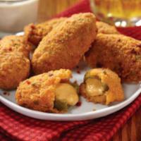 Jalapeno Poppers · Breaded jalapeno stuffed with cheese. Served with ranch sauce.