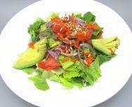 Romaine Avocado Salad · Romaine hearts with avocado, onions, tomatoes, carrots and honey sunflower seeds. Lemon vina...