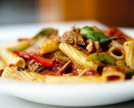 Rigatoni Sausage · Fresh rigatoni with Italian sausage, bell peppers and onions in a light tomato sauce.	