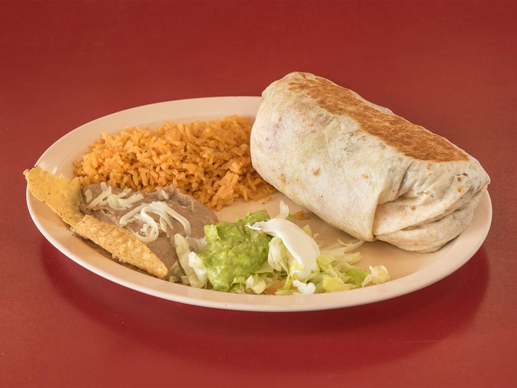 Burrito Dinner · Choice of meat: steak, chicken or ground beef 
Served with rice, and beans