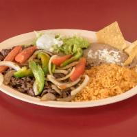 Fajitas Dinner · Choice of meat. Steak or chicken Served w/ rice and beans tortillas