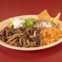 Carne Asada Dinner · Grilled skirt steak. Served with rice, beans, lettuce, sour cream, guacamole  and tortillas.