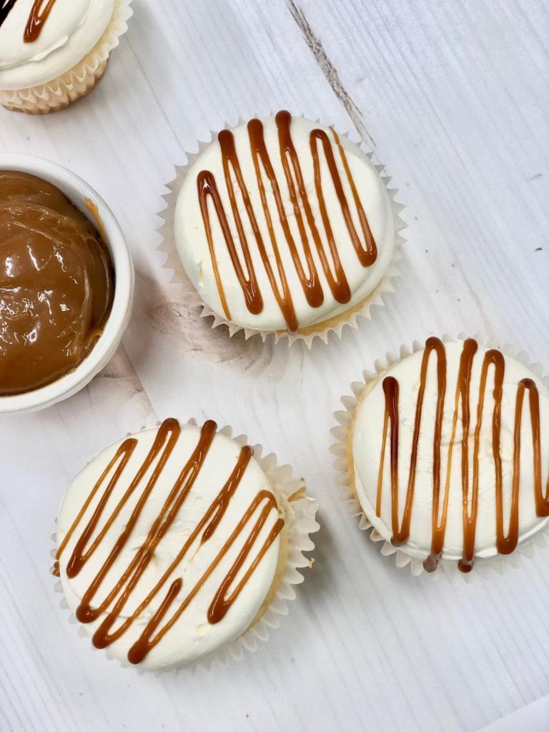 Salted Caramel  · Classic vanilla cake filled with a delicious caramel filling, topped with vanilla buttercream, drizzled with a caramel sauce and sea salt. 