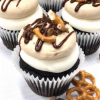 Peanut Butter Crunch Cupcake · Rich chocolate cake filled with a delicious cream filling, a layer of vanilla buttercream, p...