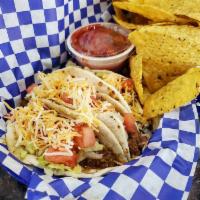 Street Tacos · 3 flour tortillas with beef or chicken lettuce and tomato.