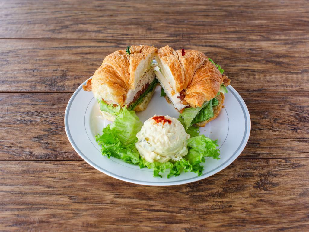 San Tan Classic Sandwich · Turkey, bacon, avocado, and Swiss cheese on a croissant.