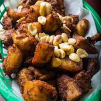 Kelewele · Seasoned chunks of ripe plantains deep fried. Served with or without peanuts.