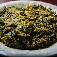 Egusi · Ground melon seeds cooked with spinach and palm oil.