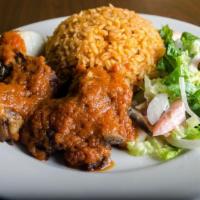 Jollof Rice · Ghanaian style rice cooked in mild tomato sauce and savory seasonings. Served with your choi...