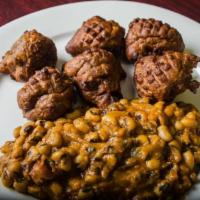 Akrakro and Beans · Over ripened and specially seasoned plantain dumplings served with black eye peas. Cooked ve...