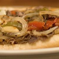 Philly Cheesesteak · Steak chopped with fried onions, sweet peppers, mushrooms and melted American cheese.