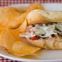 Chicken Cheesesteak Sub · Served with onions, peppers, mushrooms, lettuce, tomatoes, and mayo.