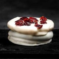 Patagonia White Alfajor · Filled with milk caramel and heart of cream berries jam covered in white chocolate.