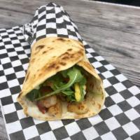The One with Chicken Flatbread · Grilled chicken, applewood bacon, avocado, tomatoes, baby Arugula and tartar sauce.