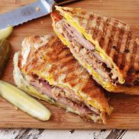#2 Cuban Sandwich (Cubano) · Deli pork, ham, Swiss cheese, mayo, and pickles on a roll.