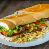 #1 Pan con Bistec · Steak, onions, lettuce, tomatoes, and potatoes sticks.