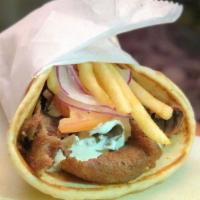 Gyro · Slow roasted rotisserie beef and lamb stuffed with tomatoes, red onions, fries and tzatziki.