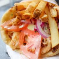 Chicken Pita · Marinated grilled chicken breast stuffed with tomatoes, red onions, fries and tzatziki.