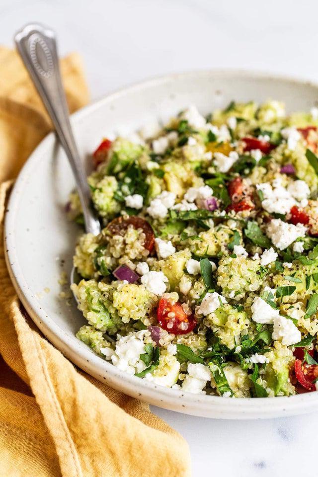 Quinoa Salad · Quinoa, avocado, cilantro, tomatoes, red onions, cucumbers and feta cheese over crispy mixed greens.