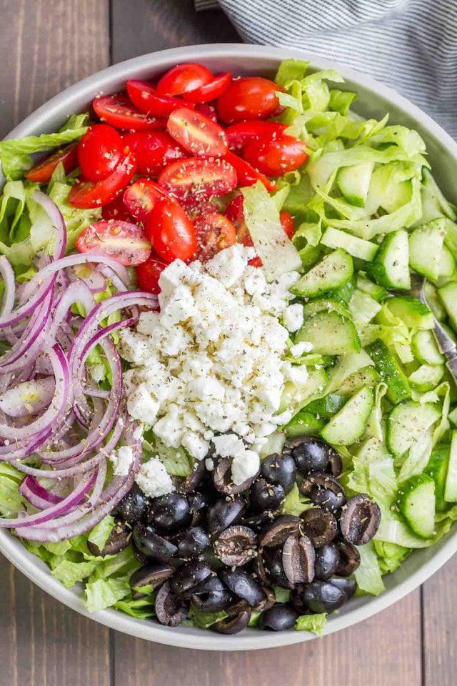 Greek Salad · Crispy mixed greens, tomatoes, onions, cucumbers, feta cheese and Kalamata olives.