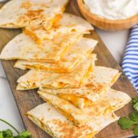 Chicken Quesadilla · Flour tortilla with grilled chicken smothered with shredded cheddar cheese.