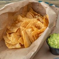 Chips & Guacamole · A small lunch bag of our corn tortilla chips fried daily and a 4 oz side of house-made guaca...