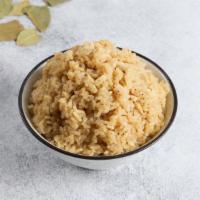 Adobo Garlic Rice · Rice wok stir fry with fresh garlic and adobo sauce - 12 oz container 