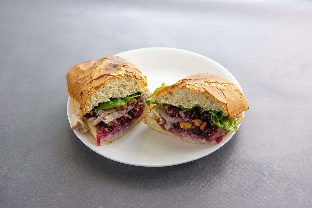 2. Turkey Cranberry Sandwich · Turkey, cream cheese, lettuce, cranberry and walnuts.