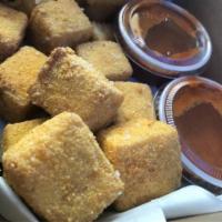 Gluten Free Tofu Nuggets · 9 pieces of gluten free tofu nuggets served with fries.