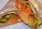 Vegetable Medley Roti Wrap · With base, sauce and toppings wrapped in our whole wheat roti.