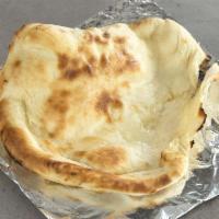Naan · Made-to-order handcrafted Indian flatbread baked in our clay oven, right in front of you!