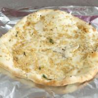 Garlic Naan · Made-to-order handcrafted Indian flatbread seasoned with Garlic then baked in our clay oven,...