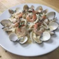 Pescatore Alfredo · Shrimp, clams, and calamari in our home-made Alfredo sauce, served over fettuccine pasta. In...