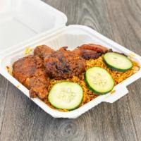 Jollof Rice Platter · lightly sautéed Jollof rice served with cucumber, a choice of meat (oven-baked chicken, stew...