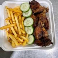 Roasted Chicken Wings (6pcs) · Served with  mixed green salad, cucumber, and a choice of sauce