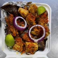 Port Harcourt Bole · Roasted plantain, yam, and roasted full fish marinated with Ethiopian spice, served with pep...