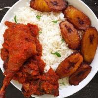 white rice platter · 
slowly cooked white rice. Served with plantain, cucumber, choice of meat and choice of stew...