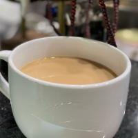 Hot Coffee Milk Tea · Hot coffee milk tea, regular size, made with non-diary creamer, sweetened with sugar.
