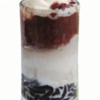 Coconut Grass Jelly Ice · Grass jelly, shaved ice, coconut creamer, topped with red bean, vanilla ice cream, and conde...
