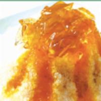 Passion Fruit Crystal Jelly Shaved Ice · Shaved ice with brown sugar water, passion fruit flavoring, topped with crystal jelly, and c...